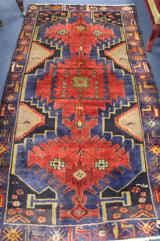 A Caucasian red ground rug, 199 x 118cm